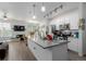 Kitchen island boasts stainless steel appliances and leads to the living and dining areas at 9185 Wilde Ln # 101, Parker, CO 80134