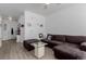 Comfortable living room with large sectional sofa, modern ceiling fan, and plenty of natural light at 9185 Wilde Ln # 101, Parker, CO 80134
