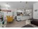 Open-concept living area combining a living room and dining area with modern appliances at 9185 Wilde Ln # 101, Parker, CO 80134