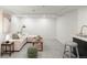 Finished basement with living area, wet bar, comfortable seating, and ample lighting at 5944 E Irwin Pl, Centennial, CO 80112