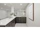 Basement bar with quartz countertop, stylish cabinets, and a convenient sink at 5944 E Irwin Pl, Centennial, CO 80112