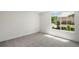 Bright bedroom features large windows, neutral carpet, and ample natural light at 5944 E Irwin Pl, Centennial, CO 80112