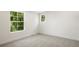Bright bedroom features large windows, neutral carpet, and ample natural light at 5944 E Irwin Pl, Centennial, CO 80112