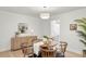 Dining room with modern light fixture, sideboard, and access to mud room at 5944 E Irwin Pl, Centennial, CO 80112