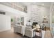 Open-concept living room features high ceilings, modern fireplace, and a view from the second story at 5944 E Irwin Pl, Centennial, CO 80112
