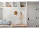 Mud room with built-in bench and cubbies for organization at 5944 E Irwin Pl, Centennial, CO 80112