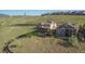 This aerial shows the side and back yard of a two-story home in a lovely neighborhood at 17102 W 85Th Pl, Arvada, CO 80007