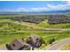Aerial view of the neighborhood displaying the layout of homes and beautiful landscape in a suburban setting at 17102 W 85Th Pl, Arvada, CO 80007