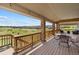 Spacious back deck with scenic views of the surrounding landscape and neighborhood at 17102 W 85Th Pl, Arvada, CO 80007