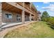 Backyard view displaying a covered patio and outdoor living space, ideal for entertaining at 17102 W 85Th Pl, Arvada, CO 80007