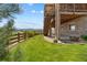 View of the backyard featuring a stone patio, grassy area, and mountain views at 17102 W 85Th Pl, Arvada, CO 80007