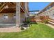 A lovely backyard showing grass, landscaping, and a wooden pergola at 17102 W 85Th Pl, Arvada, CO 80007