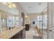 Spacious bathroom featuring double sinks, soaking tub and walk-in glass shower at 17102 W 85Th Pl, Arvada, CO 80007