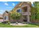 Charming front exterior with manicured lawn and stone and siding accents at 17102 W 85Th Pl, Arvada, CO 80007
