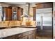 Modern kitchen featuring granite countertops, stainless steel appliances, and stylish cabinetry at 17102 W 85Th Pl, Arvada, CO 80007