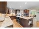 Spacious kitchen with granite countertops, a large island, and stainless steel appliances at 17102 W 85Th Pl, Arvada, CO 80007
