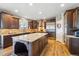 Well-appointed kitchen featuring a large island, stainless steel appliances, and ample cabinet space at 17102 W 85Th Pl, Arvada, CO 80007