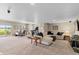 Spacious carpeted living room offers plenty of space and natural light perfect for relaxing and entertaining at 17102 W 85Th Pl, Arvada, CO 80007