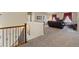 Inviting living room with staircase, plush carpet, and comfortable seating creating a welcoming space to relax at 17102 W 85Th Pl, Arvada, CO 80007
