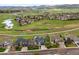 Wonderful aerial view of neighborhood with lush greenery and landscaping and mountain view in background at 6656 S Oak Cir, Littleton, CO 80127