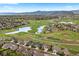 Aerial view of suburban homes with lush landscaping and mature trees and a scenic view of mountains in background at 6656 S Oak Cir, Littleton, CO 80127