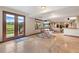 Finished basement with tiled floor, walk-out access to the yard, and fireplace with entertainment center at 6656 S Oak Cir, Littleton, CO 80127