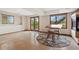 Finished basement with tiled floor, walk-out access to the yard, and fireplace at 6656 S Oak Cir, Littleton, CO 80127