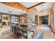 Open dining room features hardwood floors, a large table, and views into adjoining rooms at 6656 S Oak Cir, Littleton, CO 80127