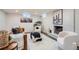 Cozy basement living area with a brick fireplace, comfortable seating, and stylish decor, perfect for relaxing and entertaining at 8105 W 62Nd Ave, Arvada, CO 80004
