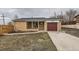 Charming home featuring a brick exterior, a driveway, and a well maintained lawn at 8105 W 62Nd Ave, Arvada, CO 80004