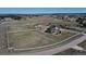 Sprawling estate featuring a well-maintained home, horse facilities, and white fencing, ideal for country living at 1465 Arabian Trl, Elizabeth, CO 80107