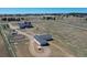 Beautiful rural property featuring a home, horse barn, and white-fenced enclosures, offering a perfect equestrian setup at 1465 Arabian Trl, Elizabeth, CO 80107