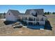 Stunning backyard with an expansive porch and stone steps, perfect for outdoor entertaining and relaxation at 1465 Arabian Trl, Elizabeth, CO 80107