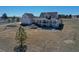 Stunning backyard with an expansive porch and stone steps, perfect for outdoor entertaining and relaxation at 1465 Arabian Trl, Elizabeth, CO 80107