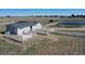 Aerial view of a barn with white fencing in a countryside setting at 1465 Arabian Trl, Elizabeth, CO 80107