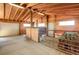 Inside horse barn with stalls, hay, and equipment at 1465 Arabian Trl, Elizabeth, CO 80107