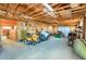 Spacious barn interior with equipment, tools, and storage areas at 1465 Arabian Trl, Elizabeth, CO 80107