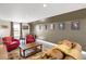 Cozy living room with comfortable seating, wood floors, and wall decor at 1465 Arabian Trl, Elizabeth, CO 80107