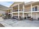 A patio with a hot tub, outdoor seating and a built-in grill at 1465 Arabian Trl, Elizabeth, CO 80107