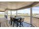 A covered porch with outdoor seating overlooking scenic views at 1465 Arabian Trl, Elizabeth, CO 80107