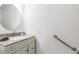 Half-bathroom with granite vanity, updated sink and hardware at 3274 S Heather Gardens Way, Aurora, CO 80014