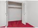 Bedroom closet with bi-fold doors and clothing rod at 3274 S Heather Gardens Way, Aurora, CO 80014