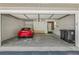 Spacious two car garage with ample storage space and parking for one car at 3274 S Heather Gardens Way, Aurora, CO 80014