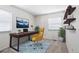 Bright office featuring plush chair, modern shelving, and window bringing in lots of natural light at 3274 S Heather Gardens Way, Aurora, CO 80014
