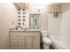 Bathroom with granite vanity, tile flooring, and shower-tub combination at 9467 W Ontario Dr, Littleton, CO 80128