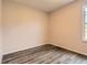 Bedroom featuring hardwood floors, a window, and neutral wall color at 9467 W Ontario Dr, Littleton, CO 80128