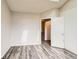 Bedroom with neutral walls, modern flooring, and closet with sliding doors at 9467 W Ontario Dr, Littleton, CO 80128