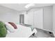 Bright bedroom featuring vaulted ceiling, skylight, and closet at 9467 W Ontario Dr, Littleton, CO 80128