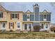 Charming townhomes featuring unique architectural details and inviting entrances at 9467 W Ontario Dr, Littleton, CO 80128