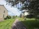 Serene community pathway with mature trees, perfect for leisurely strolls at 9467 W Ontario Dr, Littleton, CO 80128